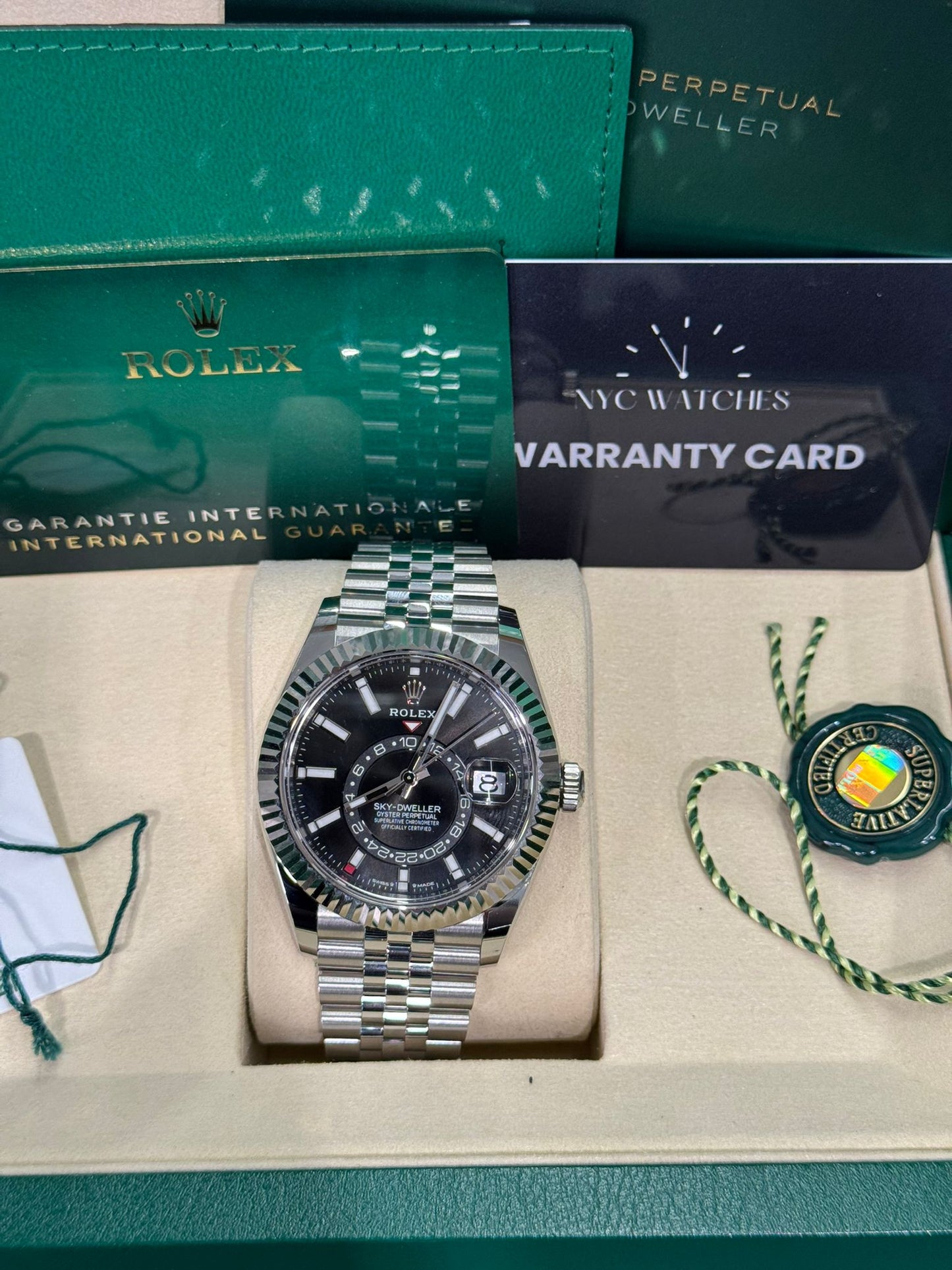 Rolex Stainless Steel and White Gold Sky Dweller Watch - 42 MM - Jubilee Bracelet - Fluted Ring Command Bezel - Black Index Dial - 336934 bkij