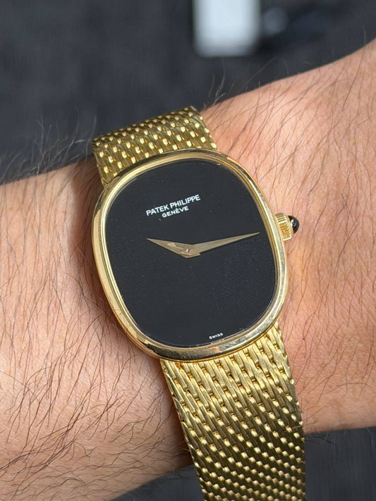 Patek Philippe Golden Ellipse - 18K Yellow Gold - Onyx Dial - Integrated Gold Bracelet - Ref. 3748/900