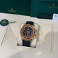 Rolex Yellow Gold Daytona Watch - 40 MM - Oysterflex Strap - Black Diamond Dial - Orange Baguette Sapphire Bezel - 116588SACO