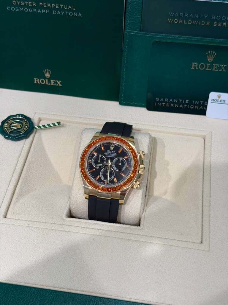 Rolex Yellow Gold Daytona Watch - 40 MM - Oysterflex Strap - Black Diamond Dial - Orange Baguette Sapphire Bezel - 116588SACO