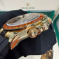 Rolex Yellow Gold Daytona Watch - 40 MM - Oysterflex Strap - Black Diamond Dial - Orange Baguette Sapphire Bezel - 116588SACO