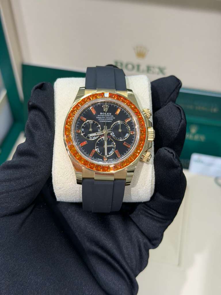 Rolex Yellow Gold Daytona Watch - 40 MM - Oysterflex Strap - Black Diamond Dial - Orange Baguette Sapphire Bezel - 116588SACO