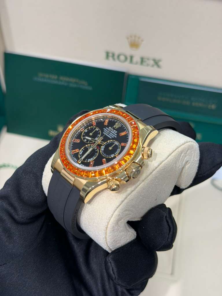 Rolex Yellow Gold Daytona Watch - 40 MM - Oysterflex Strap - Black Diamond Dial - Orange Baguette Sapphire Bezel - 116588SACO