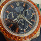 Rolex Yellow Gold Daytona Watch - 40 MM - Oysterflex Strap - Black Diamond Dial - Orange Baguette Sapphire Bezel - 116588SACO