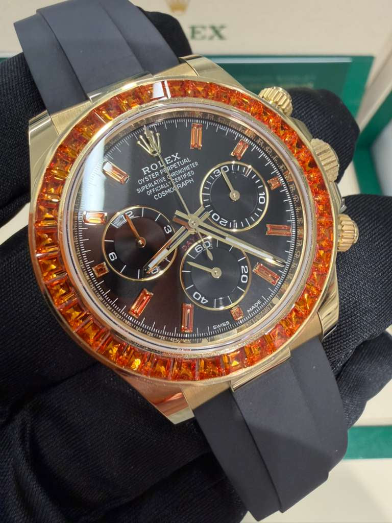 Rolex Yellow Gold Daytona Watch - 40 MM - Oysterflex Strap - Black Diamond Dial - Orange Baguette Sapphire Bezel - 116588SACO