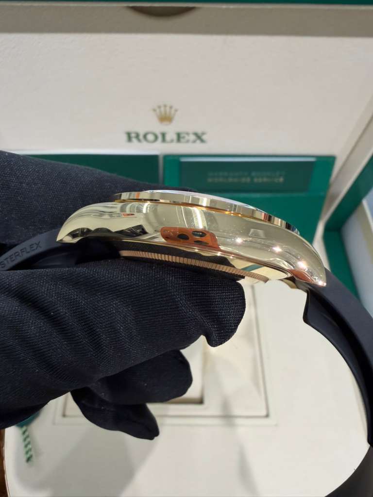 Rolex Yellow Gold Daytona Watch - 40 MM - Oysterflex Strap - Black Diamond Dial - Orange Baguette Sapphire Bezel - 116588SACO