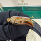 Rolex Yellow Gold Daytona Watch - 40 MM - Oysterflex Strap - Black Diamond Dial - Orange Baguette Sapphire Bezel - 116588SACO