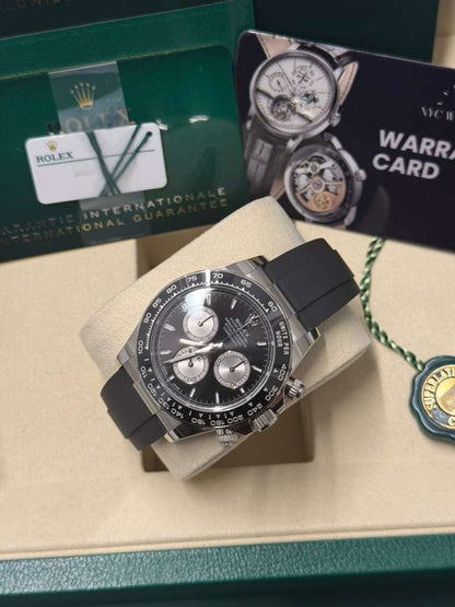 Rolex White Gold Cosmograph Daytona Watch - 40 MM - Oysterflex Strap - Black Ceramic Bezel - Black And Steel Index Dial - 126519LN-0002