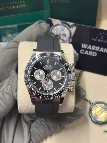 Rolex White Gold Cosmograph Daytona Watch - 40 MM - Oysterflex Strap - Black Ceramic Bezel - Black And Steel Index Dial - 126519LN-0002