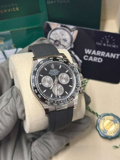 Rolex White Gold Cosmograph Daytona Watch - 40 MM - Oysterflex Strap - Black Ceramic Bezel - Black And Steel Index Dial - 126519LN-0002