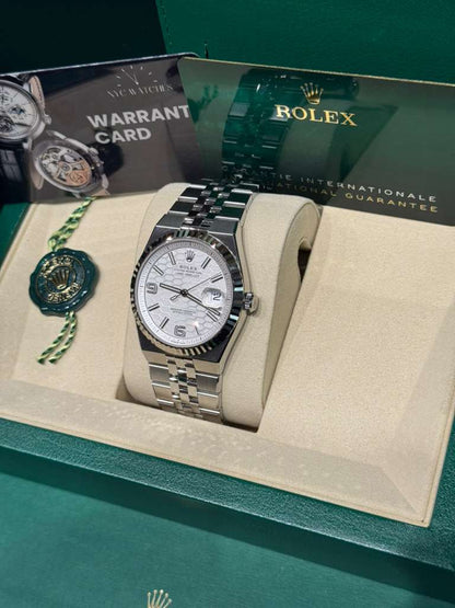 Rolex Land-Dweller - 40 MM - Stainless Steel and White Gold - Honeycomb Motif White Dial - Fluted Bezel - Jubilee Bracelet - 127334-0001