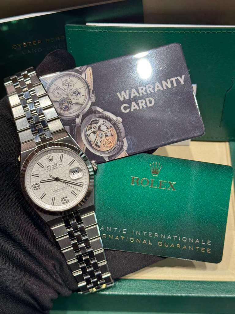 Rolex Land-Dweller - 40 MM - Stainless Steel and White Gold - Honeycomb Motif White Dial - Fluted Bezel - Jubilee Bracelet - 127334-0001
