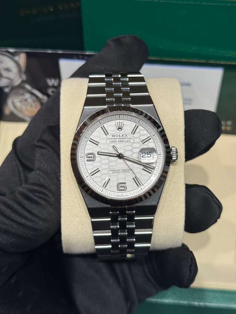 Rolex Land-Dweller - 40 MM - Stainless Steel and White Gold - Honeycomb Motif White Dial - Fluted Bezel - Jubilee Bracelet - 127334-0001