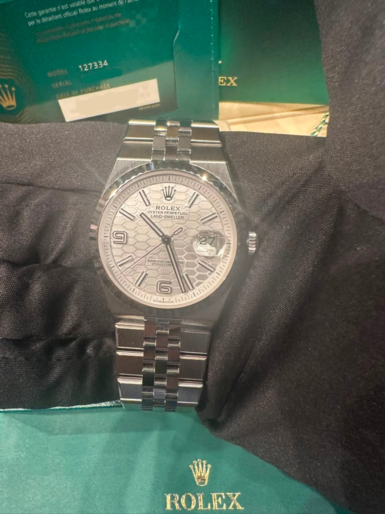 Rolex Land-Dweller - 40 MM - Stainless Steel and White Gold - Honeycomb Motif White Dial - Fluted Bezel - Jubilee Bracelet - 127334-0001