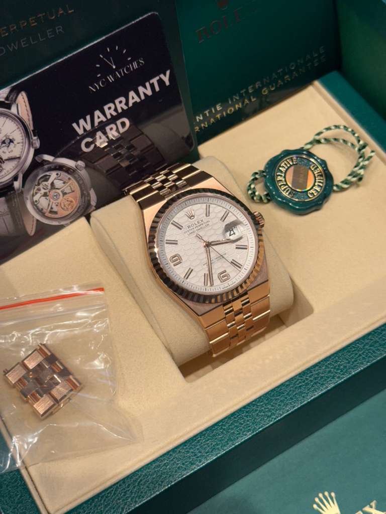 Rolex Land-Dweller - 40 MM - Rose Gold - Honeycomb Motif Intense White Dial - Fluted Bezel - Jubilee Bracelet - 127335-0001