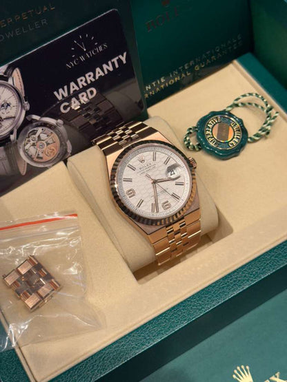 Rolex Land-Dweller - 40 MM - Rose Gold - Honeycomb Motif Intense White Dial - Fluted Bezel - Jubilee Bracelet - 127335-0001