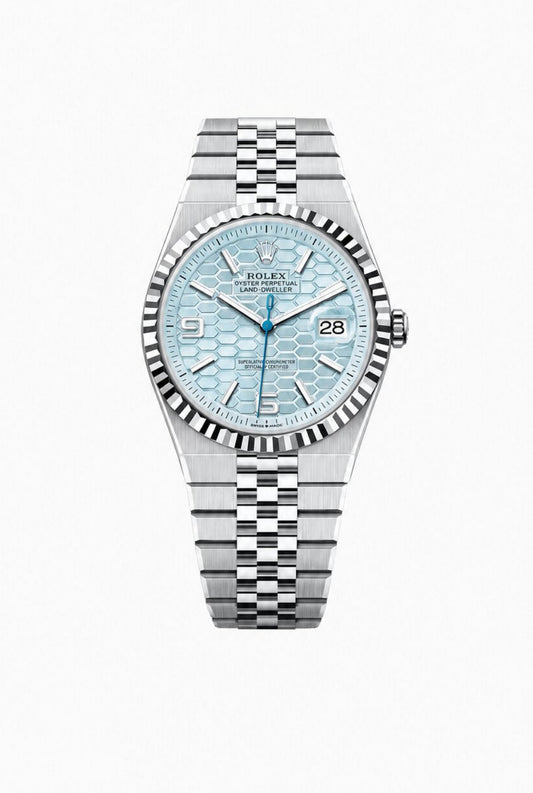 Rolex Land-Dweller - 40 MM - Platinum - Honeycomb Motif Ice Blue Dial - Fluted Bezel - Jubilee Bracelet - 127336-0001