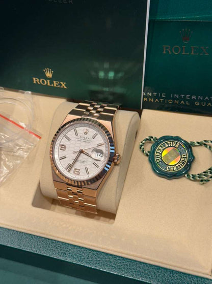 Rolex Land-Dweller - 40 MM - Rose Gold - Honeycomb Motif Intense White Dial - Fluted Bezel - Jubilee Bracelet - 127335-0001