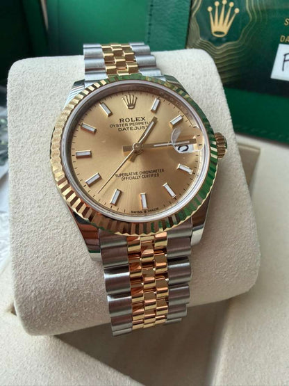 Rolex Steel and Yellow Gold Datejust - 31 MM - Jubilee Bracelet - Fluted Bezel - Champagne Index Dial - 278273-0014