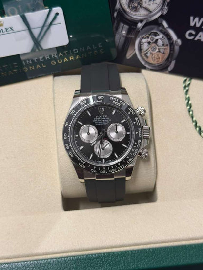Rolex White Gold Cosmograph Daytona Watch - 40 MM - Oysterflex Strap - Black Ceramic Bezel - Black And Steel Index Dial - 126519LN-0002