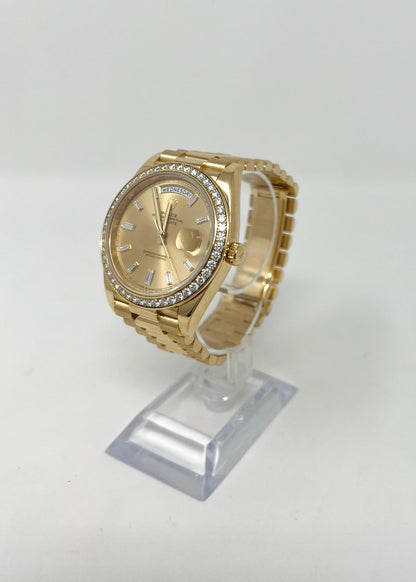 Rolex Yellow Gold Day-Date 40 MM - President Bracelet - Diamond Bezel - Champagne Baguette Diamond Dial - 228348RBR-0002