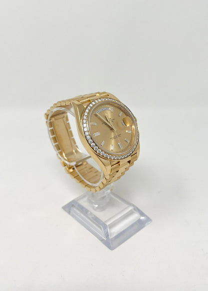 Rolex Yellow Gold Day-Date 40 MM - President Bracelet - Diamond Bezel - Champagne Baguette Diamond Dial - 228348RBR-0002