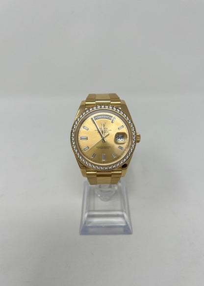 Rolex Yellow Gold Day-Date 40 MM - President Bracelet - Diamond Bezel - Champagne Baguette Diamond Dial - 228348RBR-0002