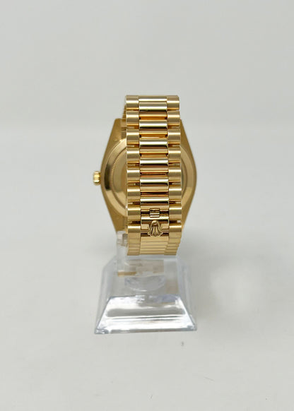 Rolex Yellow Gold Day-Date 40 MM - President Bracelet - Diamond Bezel - Champagne Baguette Diamond Dial - 228348RBR-0002