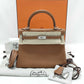 Hermès Kelly Retourne 25 - Gold Togo Leather - Palladium Hardware - K25GTPHW