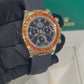 Rolex Yellow Gold Daytona Watch - 40 MM - Oysterflex Strap - Black Diamond Dial - Orange Baguette Sapphire Bezel - 116588SACO